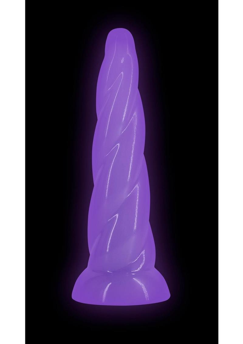 Firefly Siren Glow in The Dark Dildo Purple illuminated in a dark setting, featuring a twisted design and soft purple glow.