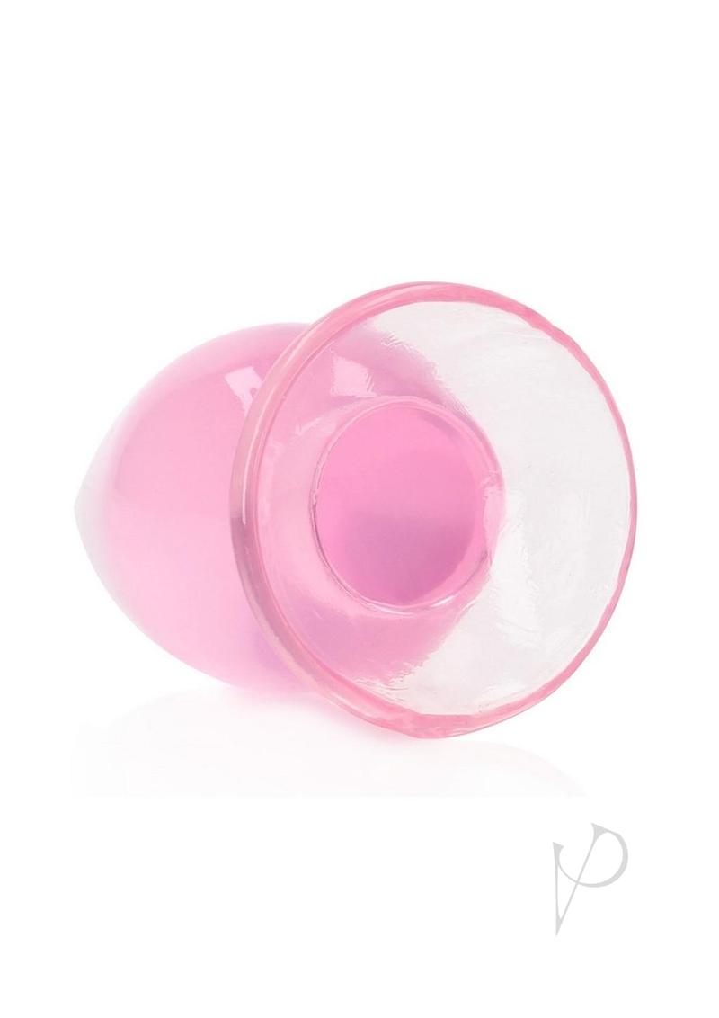 RealRock Crystal Clear Anal Plug 4.5 Inch Pink showcasing its see-through design and smooth texture for comfortable use.