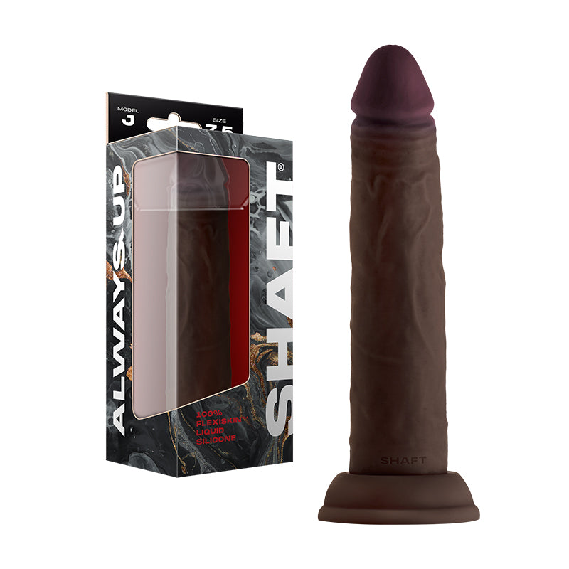 Shaft Model J 7.5 inch Dual Density Silicone Dildo Mahogany with packaging on display.