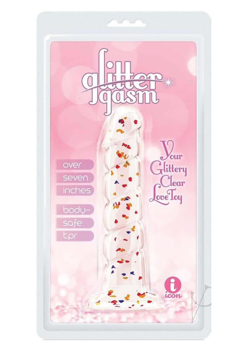 Glittergasm Swirl Clear Dildo with Suction Cup in packaging on a pink background, showcasing its glittery design.