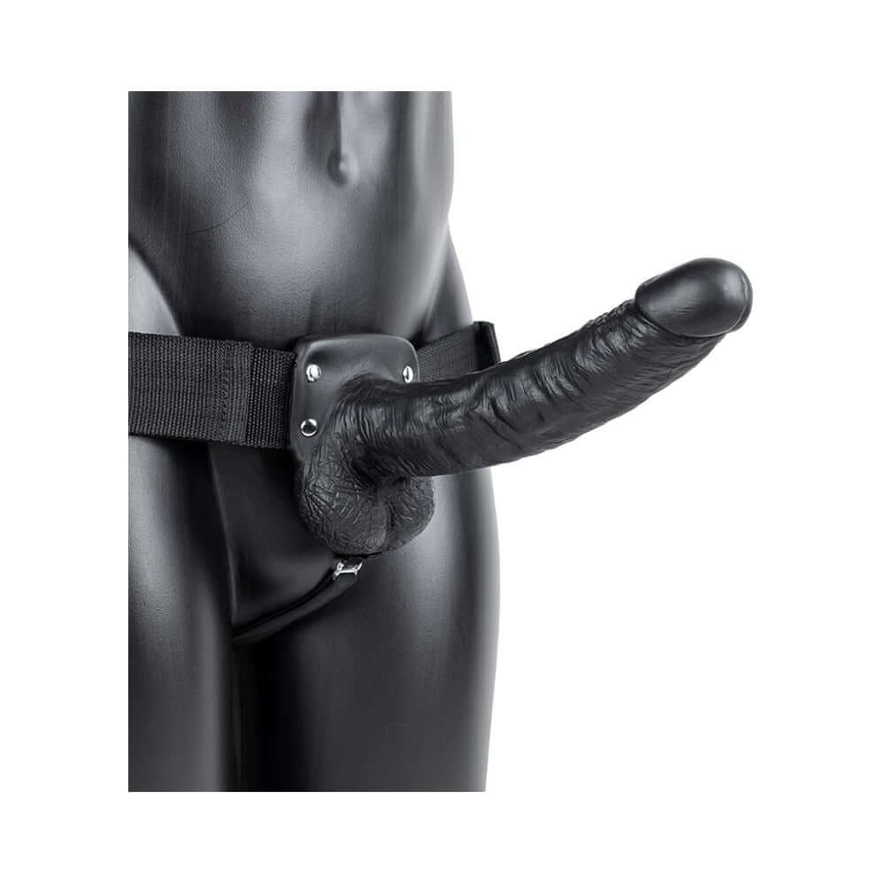 RealRock Realistic 9 inch Vibrating Hollow Strap-On With Balls Black on a mannequin, showcasing realistic design and features.