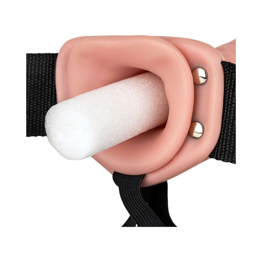 Close-up view of the RealRock Realistic 6 inches Hollow Strap-On Beige showcasing its adjustable strap and hollow design.