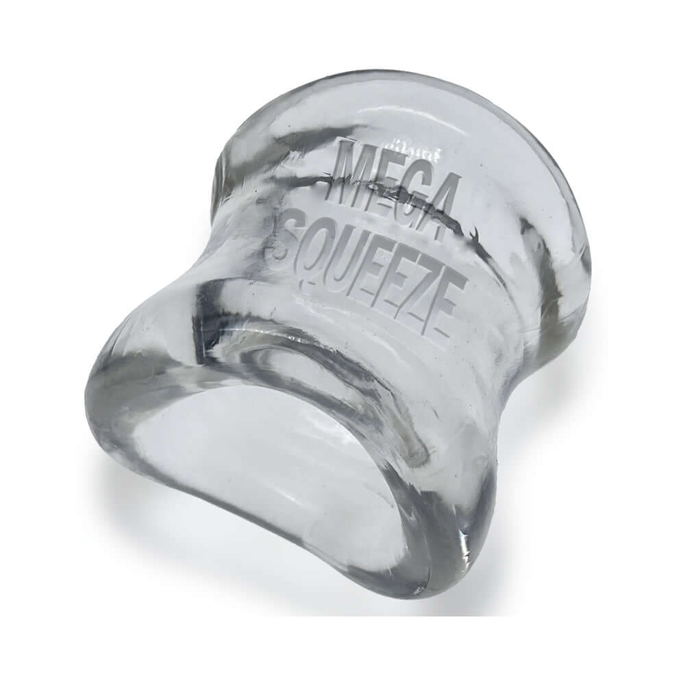 Oxballs Mega Squeeze Ergofit Ballstretcher Clear made from glossy flexTPR, designed for enhanced comfort and secure hold.