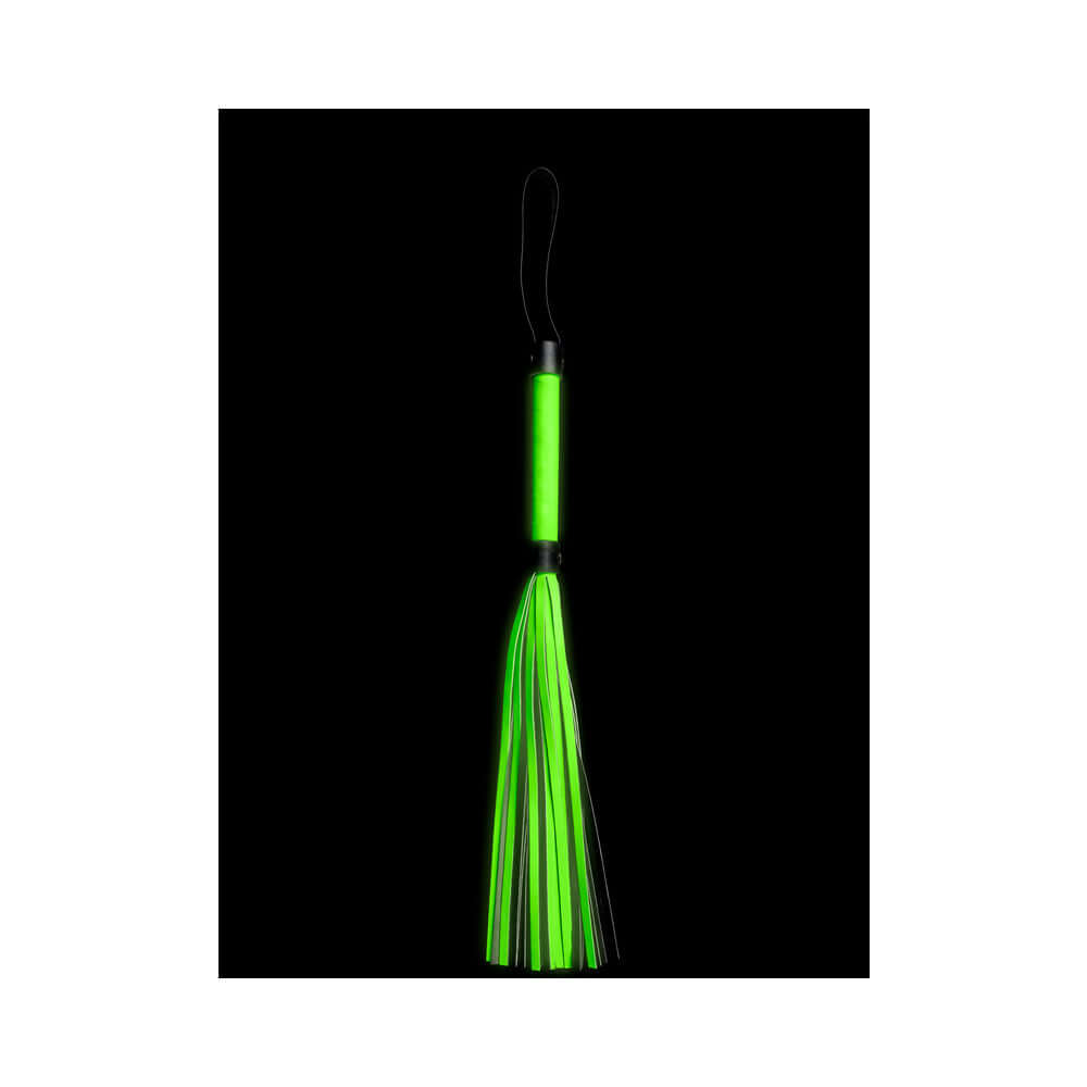 Ouch Glow in the Dark Bonded Leather Flogger Neon Green on a black background with vibrant neon glow.