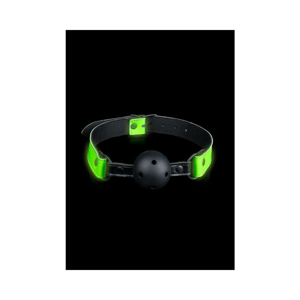 Ouch Glow in the Dark Bonded Leather Breathable Ball Gag Neon Green on a black background.