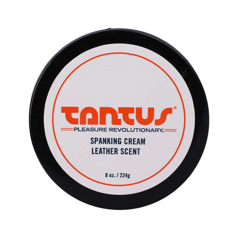 Tantus Apothecary Spanking Cream Leather Scent 8 Oz in a round container with branding and product information.