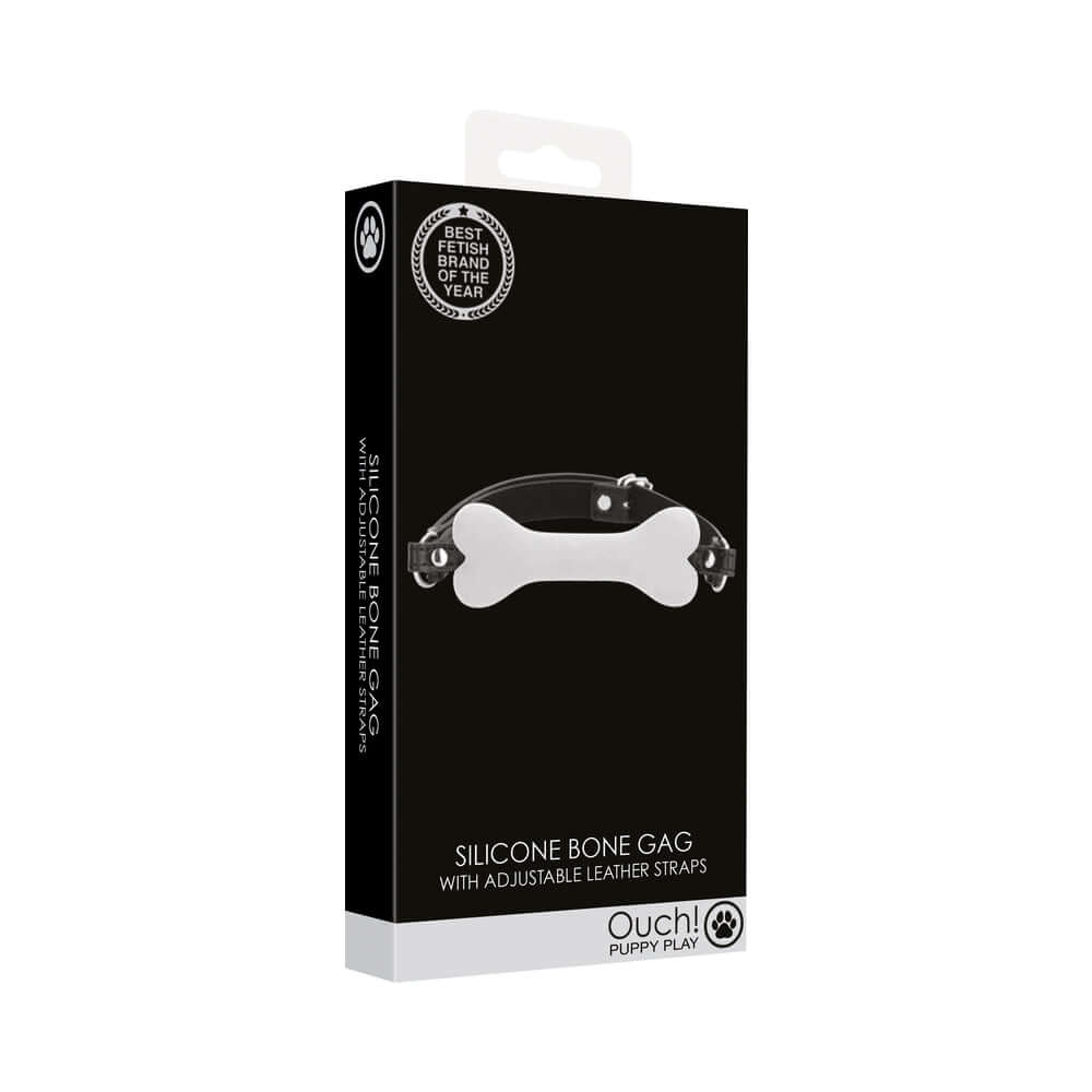 Ouch Puppy Play Silicone Bone Gag White packaging with adjustable leather straps for playful role-play.