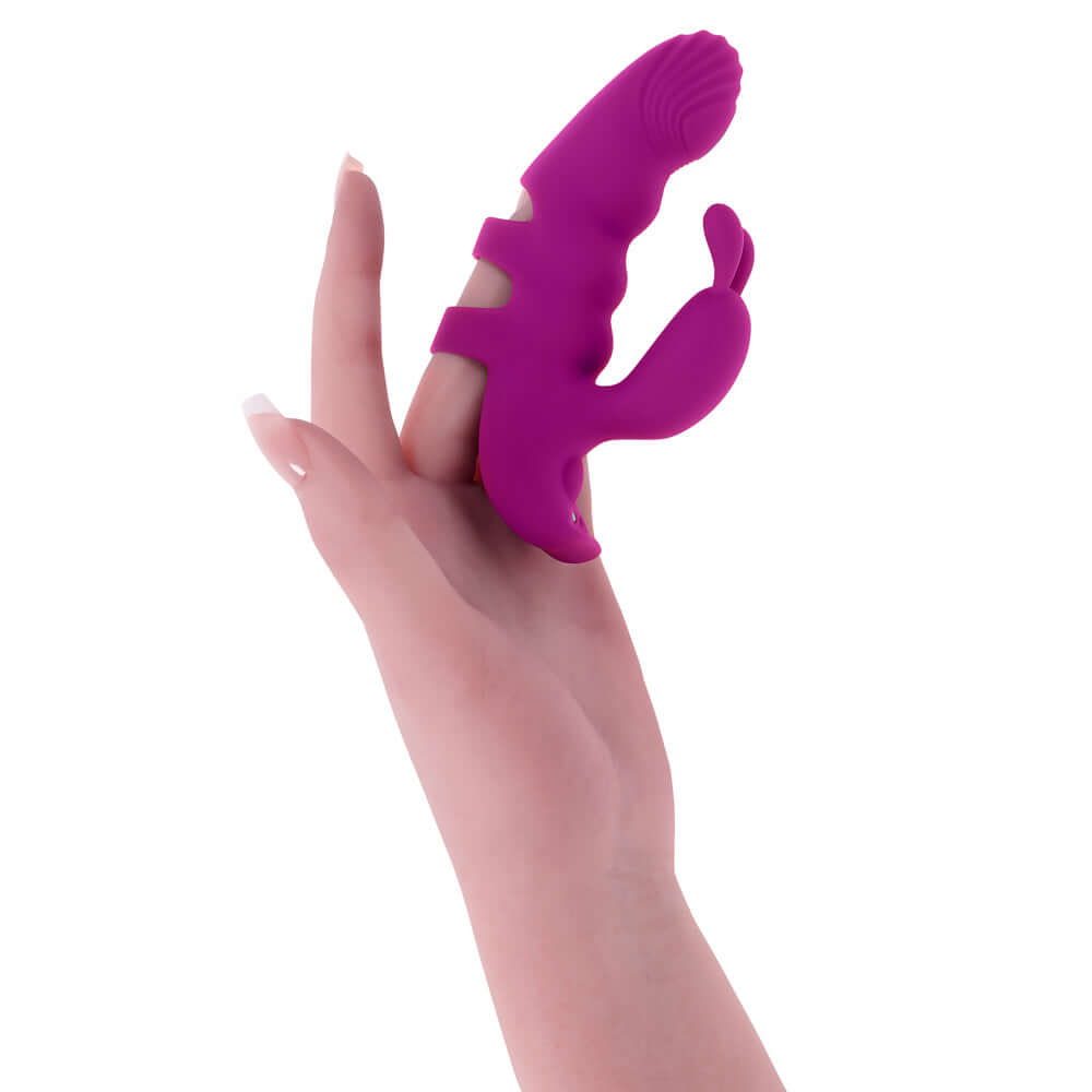 Playboy Pleasure Lend A Hand Finger Vibrator shown on a hand, highlighting its ergonomic design and functionality.