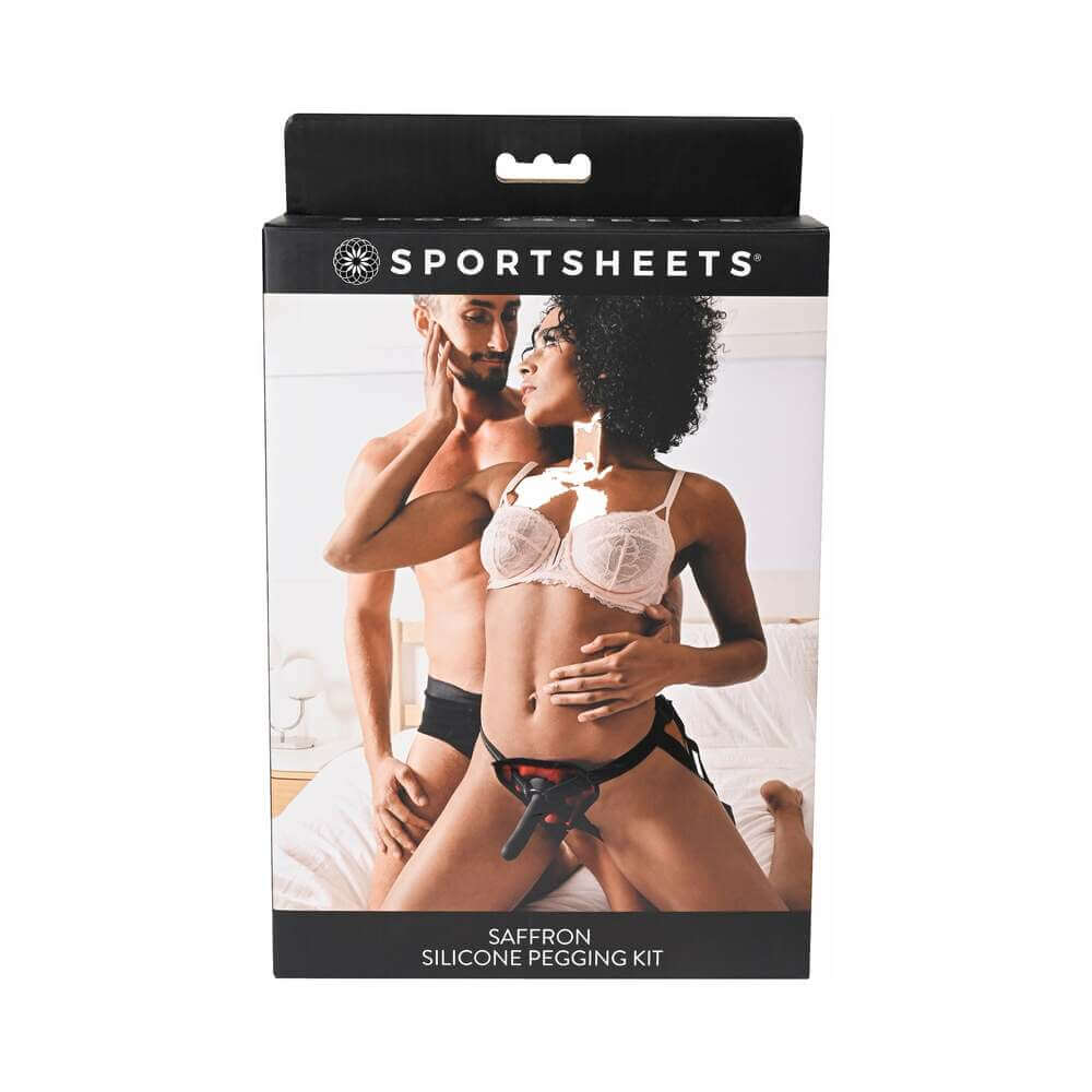 Saffron Silicone Pegging Kit with Strap-On Harness & 5 inches Dildo packaging featuring couple in intimate setting.