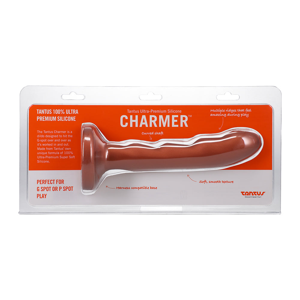 Tantus Charmer 8 inch G-spot Dildo Firm Copper in packaging showcasing its curved shaft and ridged design.