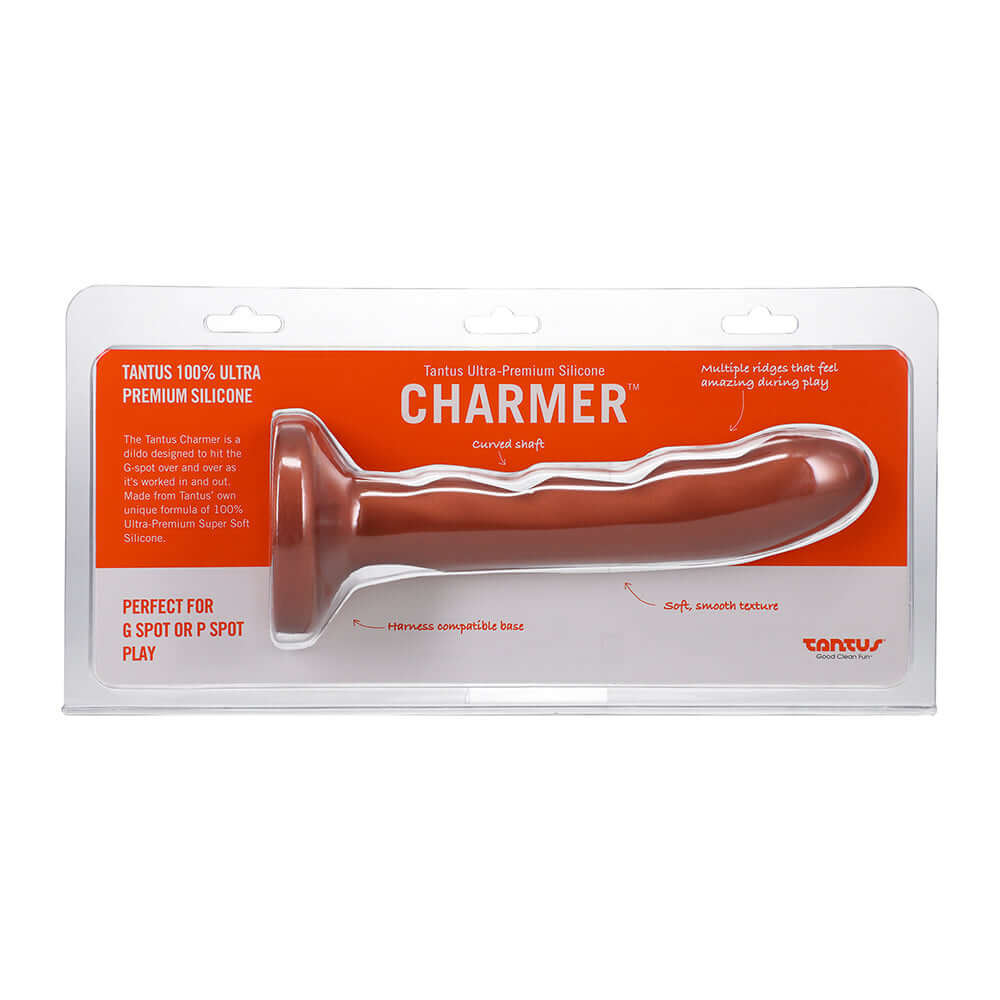 Tantus Charmer 8 inch G-spot Dildo Firm Copper in packaging showcasing its curved shaft and ridged design.