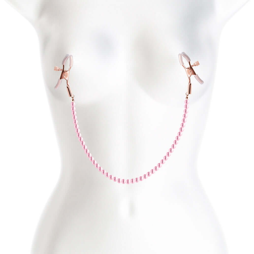 Bound Nipple Clamps Pink with a chain on a mannequin torso for sensory play.