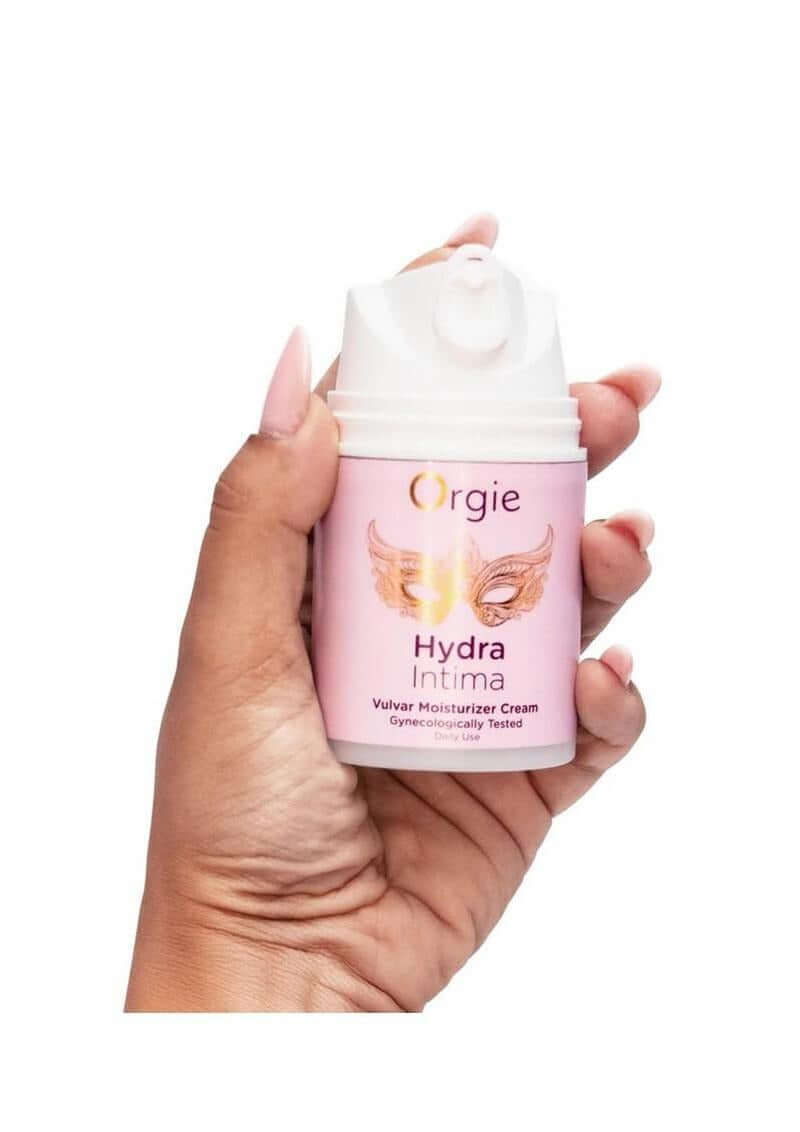 Orgie Hydra Intimate Vulvar Moisturizer Cream 1.7 Oz held in hand, showcasing the product packaging.