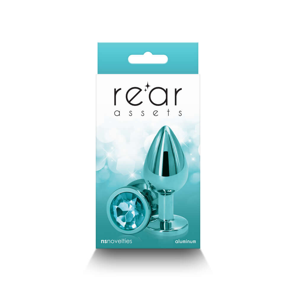 Rear Assets Metal Anal Plug Medium Teal in packaging, featuring sleek design and chrome-plated aluminum finish.