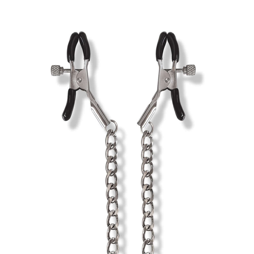 Nixie Metal Bondage 8-piece Kit Silver featuring metal clamps and chain accessories for BDSM experiences.