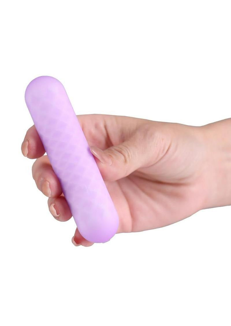 Minnie's Spark Rechargeable Silicone Flexible Bullet Purple held in hand, designed for smooth, all-over stimulation.