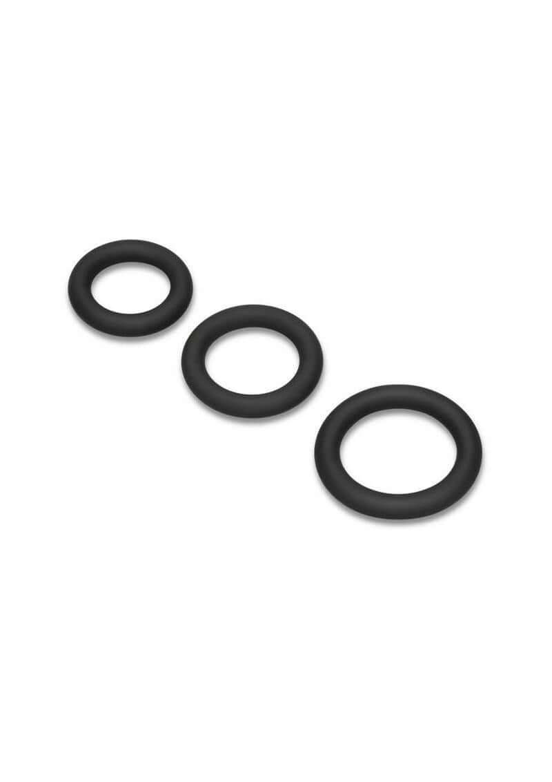 B-Vibe Snug Ring Thick Silicone Cock Ring 3 Pack Black featuring three black silicone rings for enhanced performance.