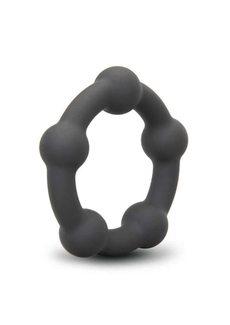 B-Vibe Snug Ring Orbit Nubby Silicone Cock Ring Black on a white background, showcasing its unique nubby design.