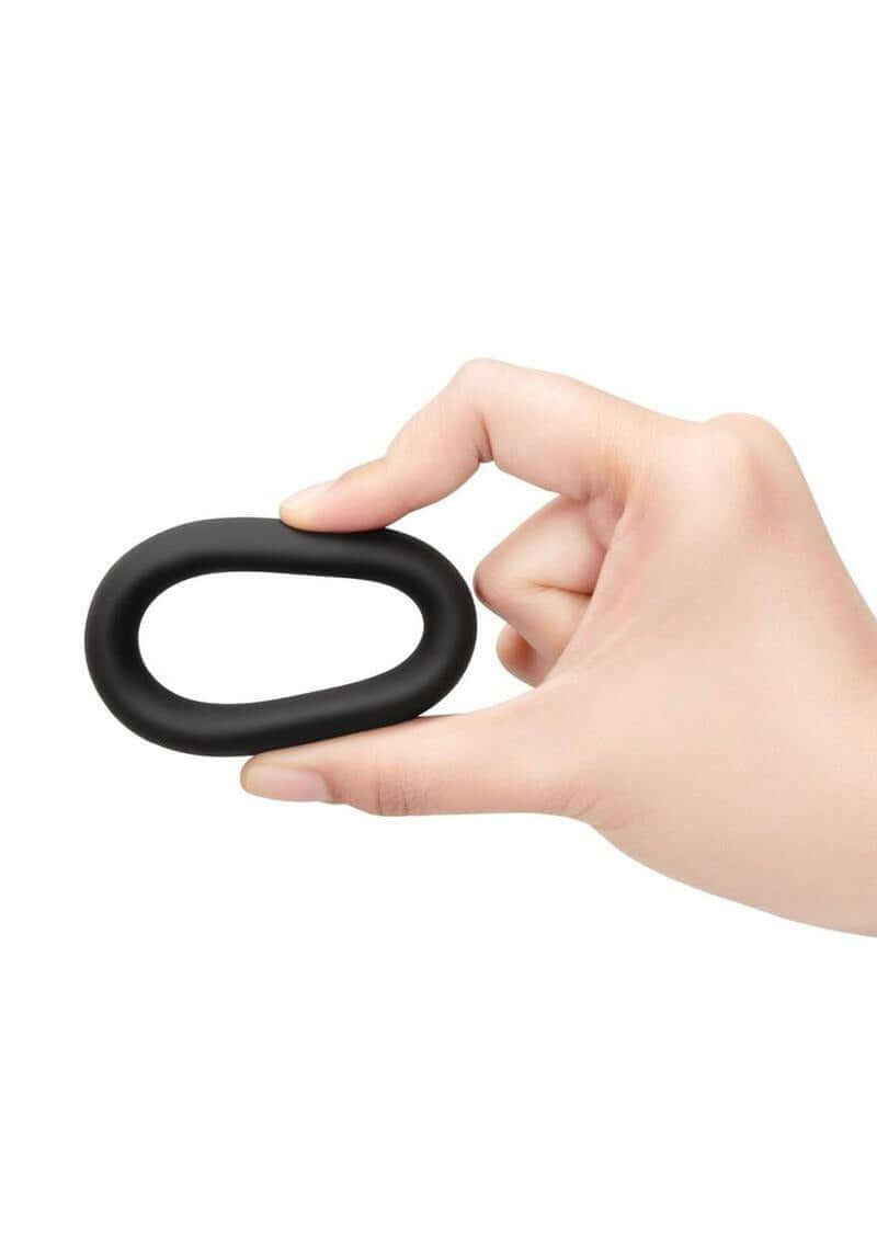 B-Vibe Snug Ring Silicone Cock Ring 40 mm Black held in hand showing its comfortable and durable design.