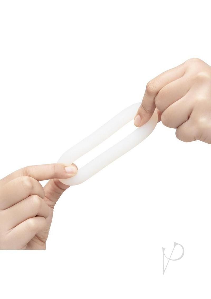 B-Vibe Flex Ring Loop Silicone Cock Ring Clear shown being stretch by hands for enhanced performance and comfort.