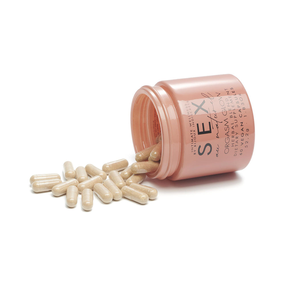 Bijoux Indiscrets Orgasm Glow Supplement 60 Capsules in a jar with spilled capsules.