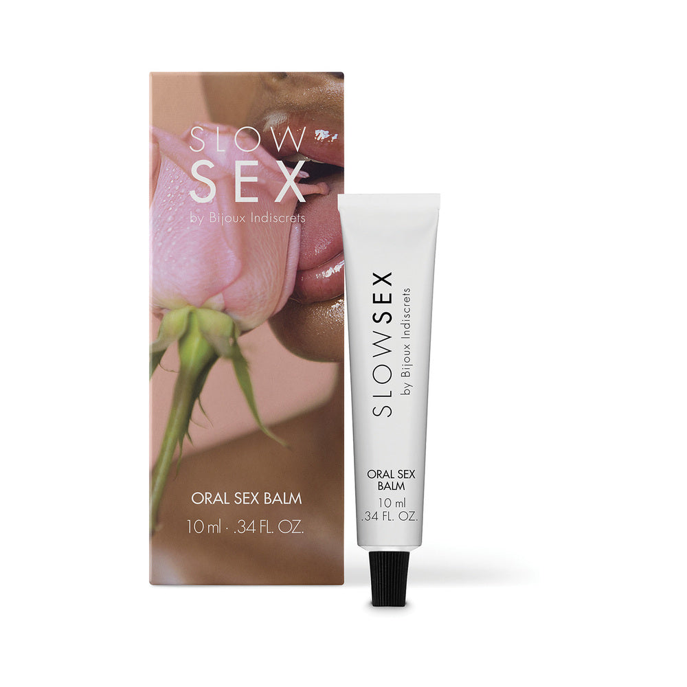 Bijoux Indiscrets Slow Sex Oral Sex Balm 0.34 Oz packaging with tube and floral background, highlighting sensuality.