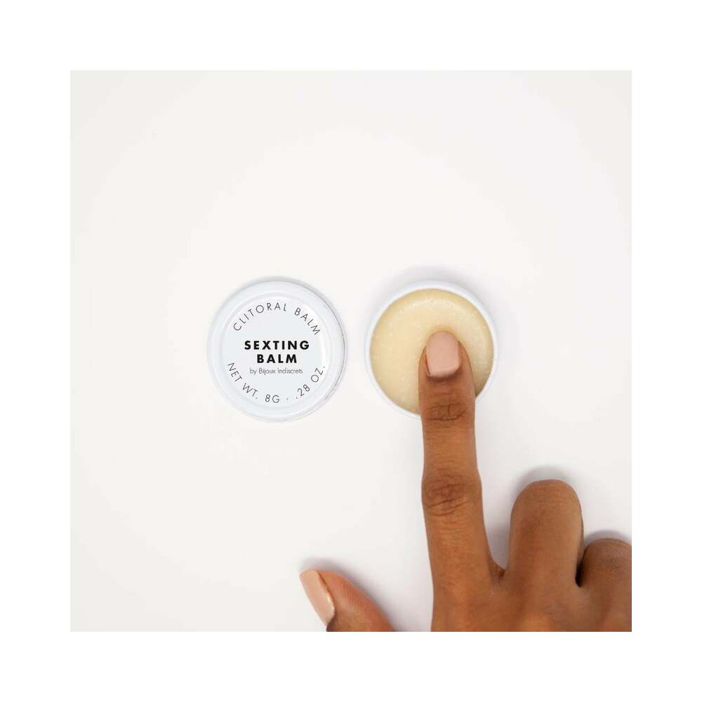 Bijoux Indiscrets Clitherapy Sexting Clitoral Balm 0.28 Oz, finger applying to clitoral balm.