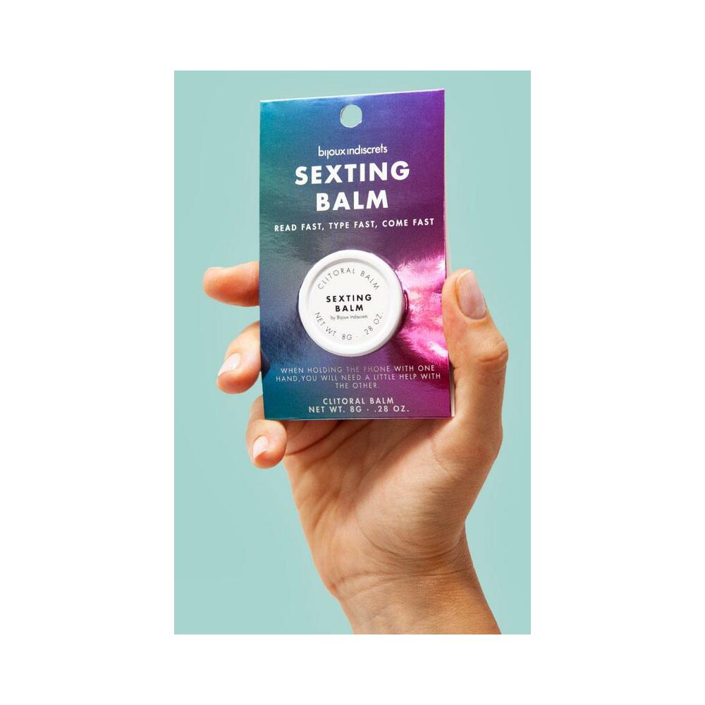 Bijoux Indiscrets Clitherapy Sexting Clitoral Balm 0.28 Oz in hand with colorful packaging.