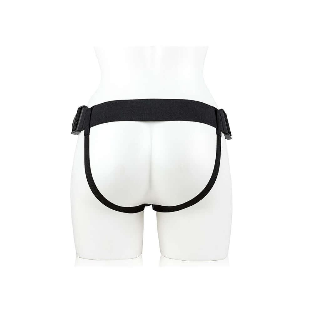 RealRock 9 Inch Hollow Strap-On with Balls Tan adjustable harness viewed from behind on a mannequin.