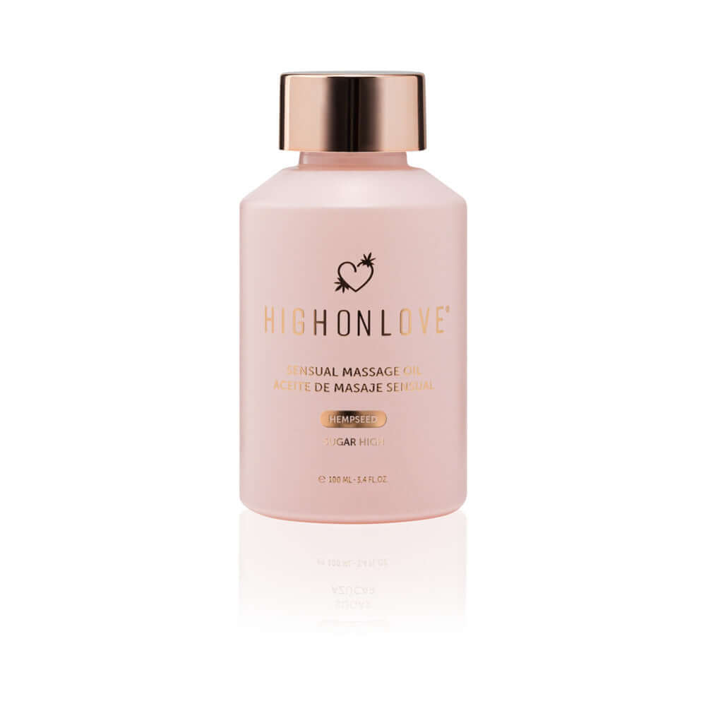 HighOnLove Objects of Luxury Gift Set Sensual Massage Oil in a pink bottle with gold cap.