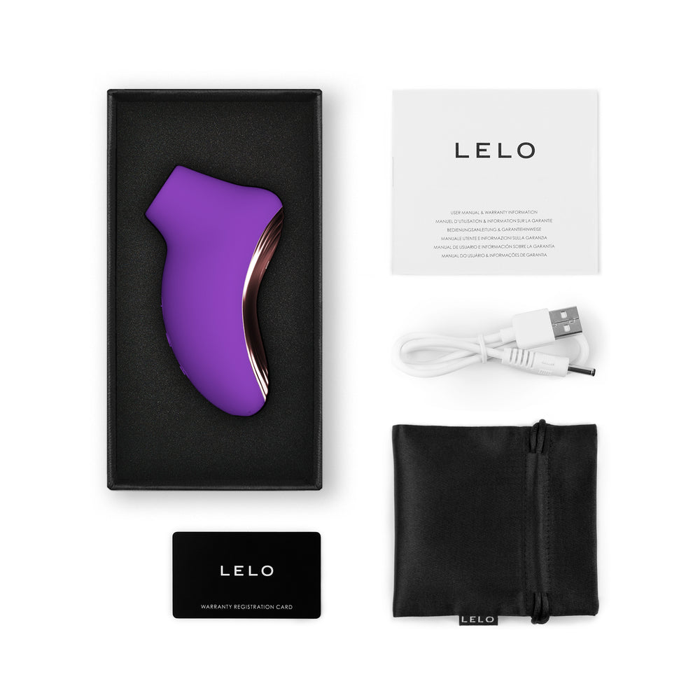 LELO SONA 2 Travel Clitoral Massager Purple in packaging with accessories, charger, and warranty card.