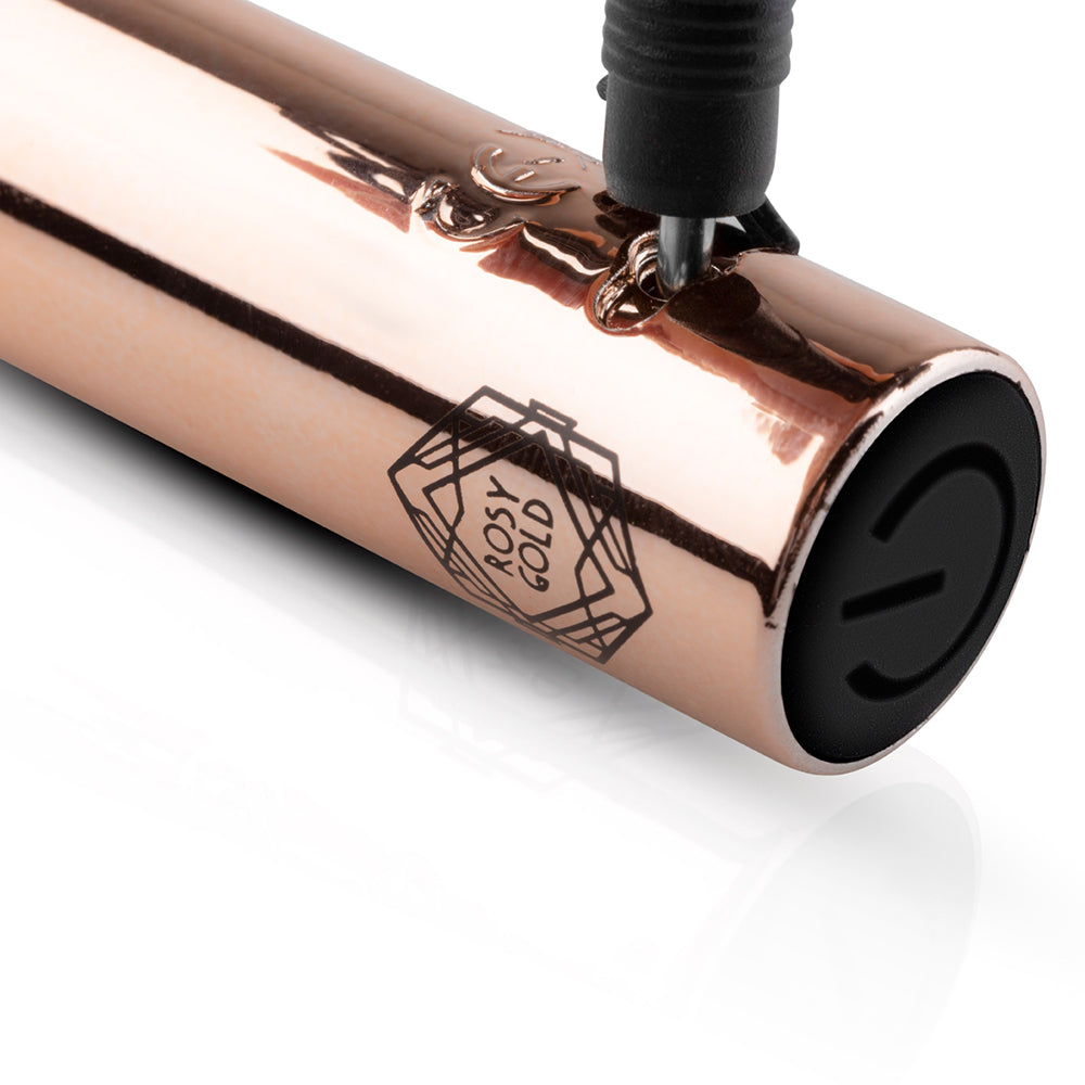 Close-up of the Rosy Gold Nouveau G-spot Vibrator showcasing its elegant design and branding.