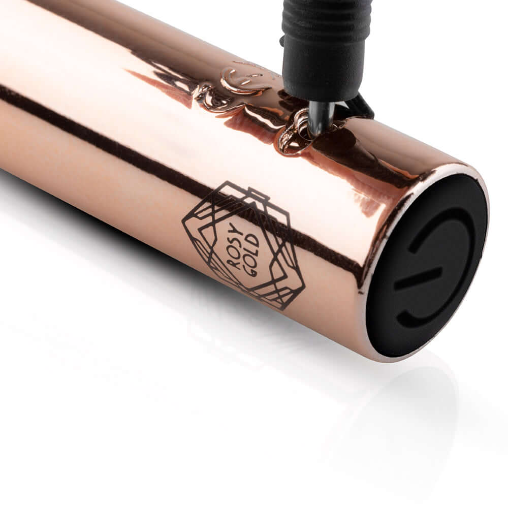 Close-up of the Rosy Gold Nouveau G-spot Vibrator showcasing its elegant design and branding.