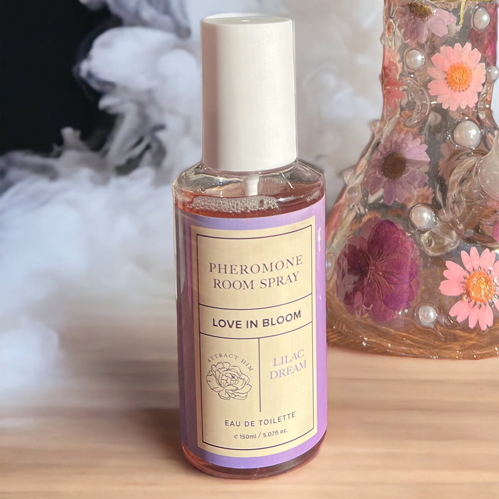 Eye of Love Bloom Attract Him Pheromone Room Spray Lilac Dream 5 Oz bottle with floral background.
