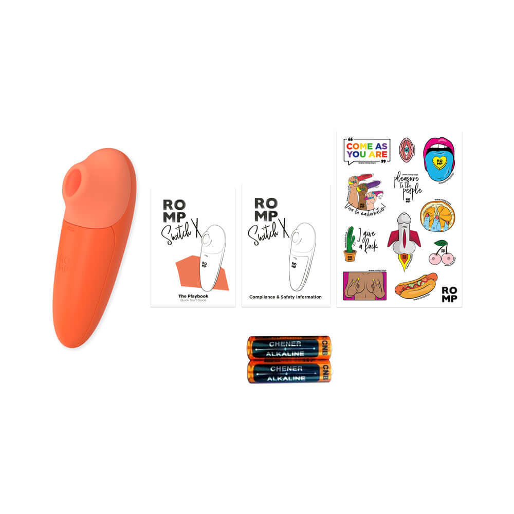 ROMP Switch X Clitoral Stimulator, orange device, user guide, safety info, stickers, and batteries included