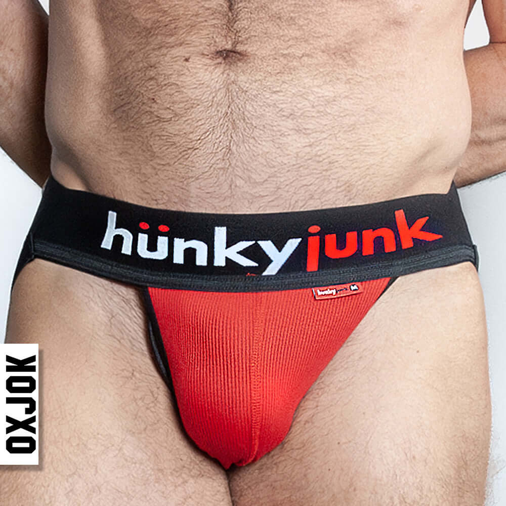 Oxballs Oxjok Hunker Comfy-Pouch Slider-Strap Jock Red 2XL worn by a model showcasing the bold comfort and design.