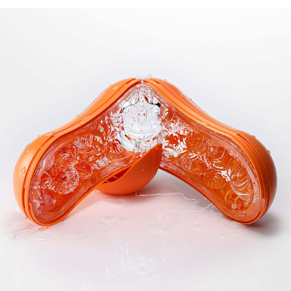 Tenga Flip Orb Sunset Orange Stroker showcasing inner orbs and elastomer texture for enhanced stimulation.