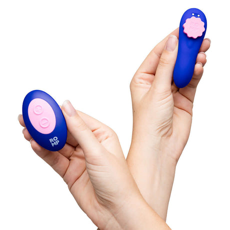 ROMP Party Wearable Panty Vibrator Purple remote controls held in hands for thrilling clitoral pleasure.