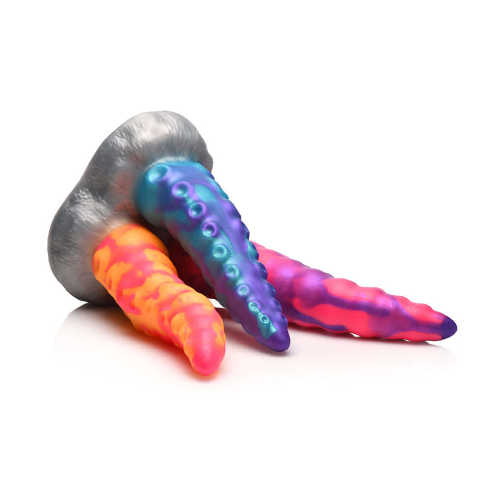 Creature Cocks Tentacle Trio Silicone Dildo featuring vibrant tentacles in orange, pink, and blue, designed for adventurous exploration.