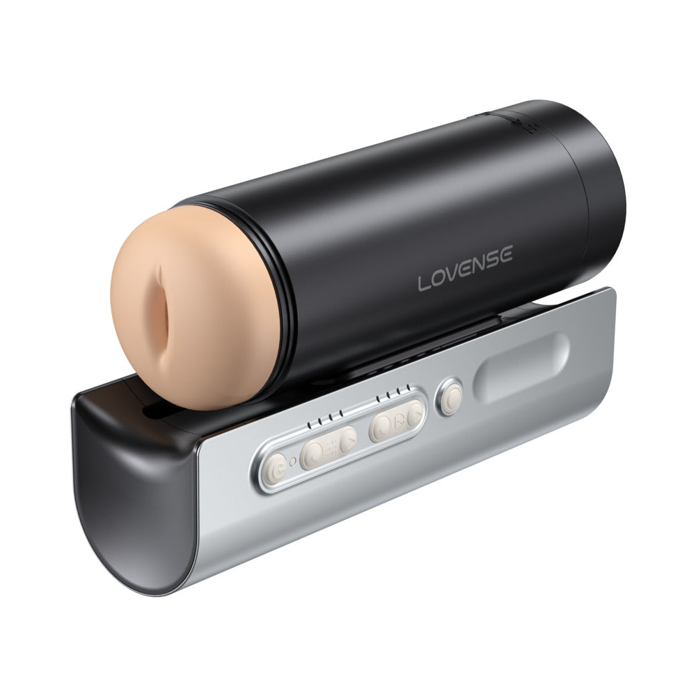 Lovense Solace Pro App Controlled Automatic Male Stroker on a sleek charging dock with control buttons