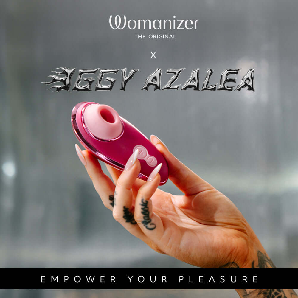 Womanizer x Iggy Azalea Liberty 2 Special Edition Metal Pink in a hand, empowering your pleasure with vibrant design.