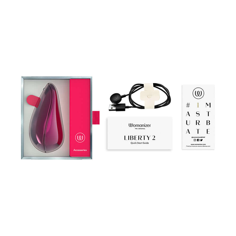 Womanizer x Iggy Azalea Liberty 2 Special Edition Metal Pink packaged with accessories and guide.