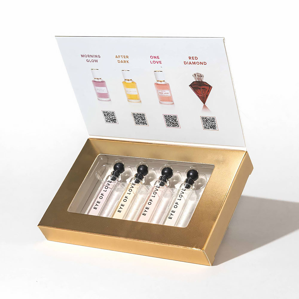 Eye Of Love Pheromone Parfum Attract Him Sample Set showcasing fragrance vials in a luxurious gold box.