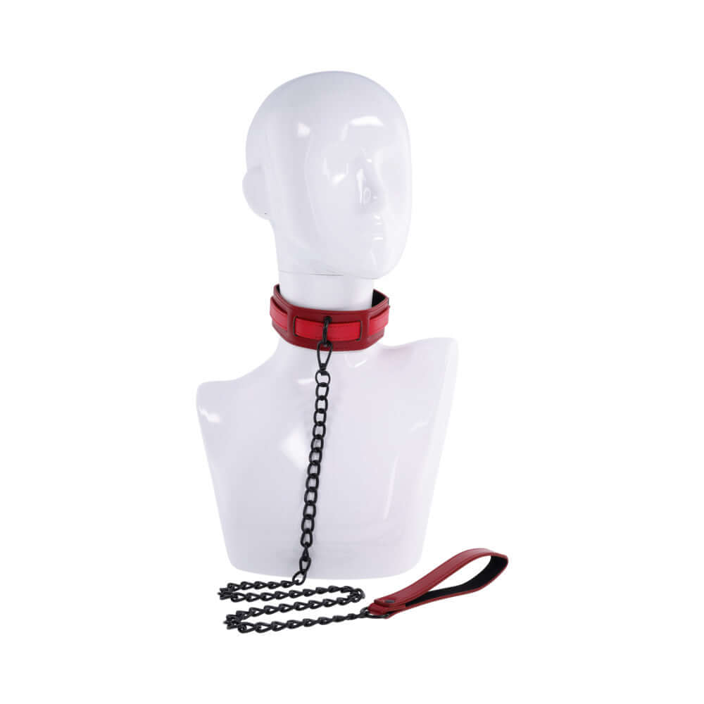 Sportsheets Sex and Mischief Exs & Ohs Collar and Leash on a mannequin displaying a deep red faux leather design.