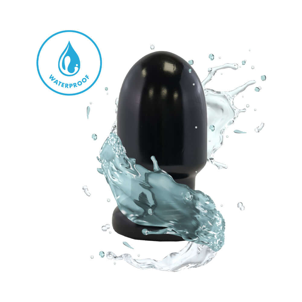 Prowler RED Thud 5 inch Anal Plug Black, waterproof design with smooth tapered shape in a splashing water background.