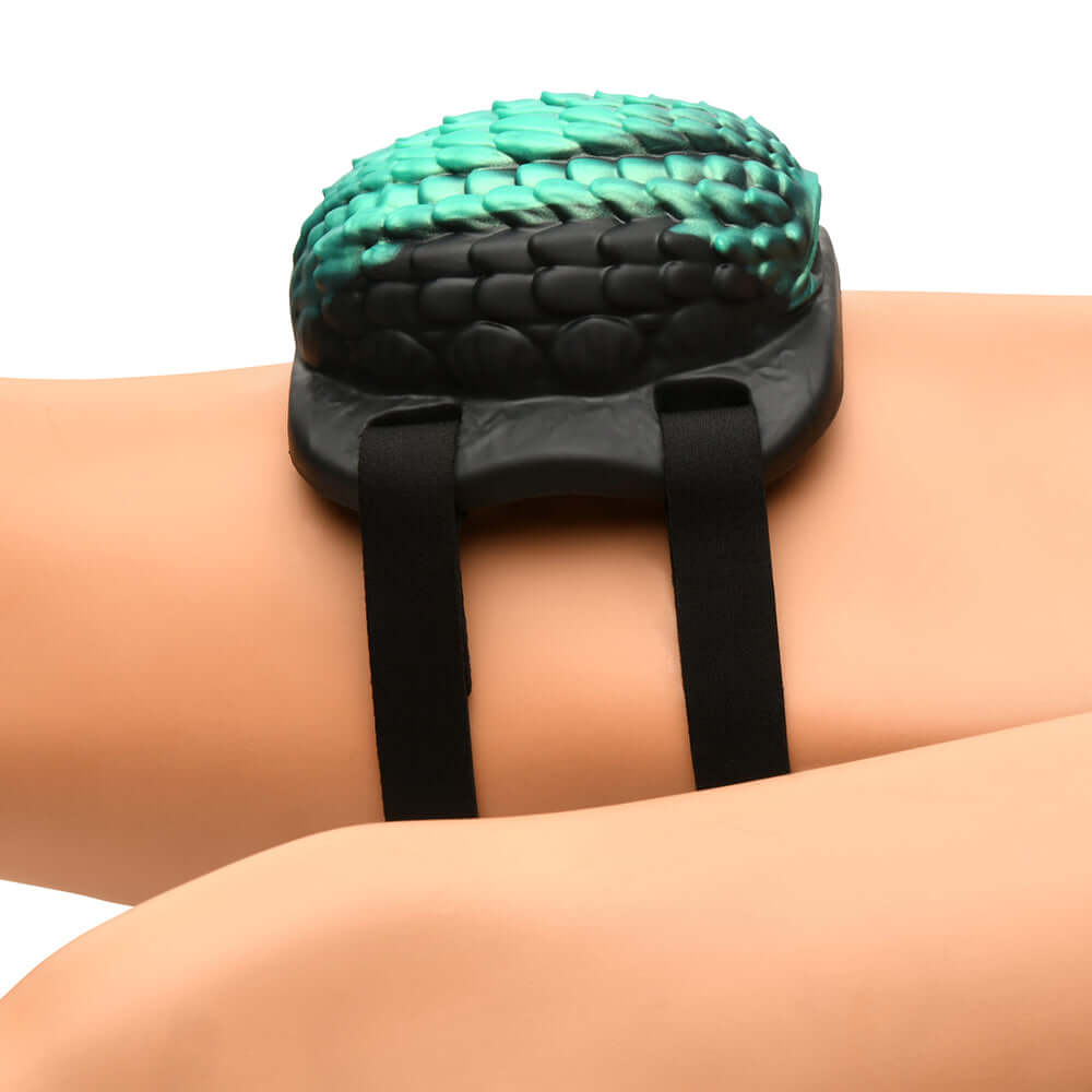 Creature Cocks Dragon Vibrating Silicone Grinder on skin, showcasing its unique dragon scale design.