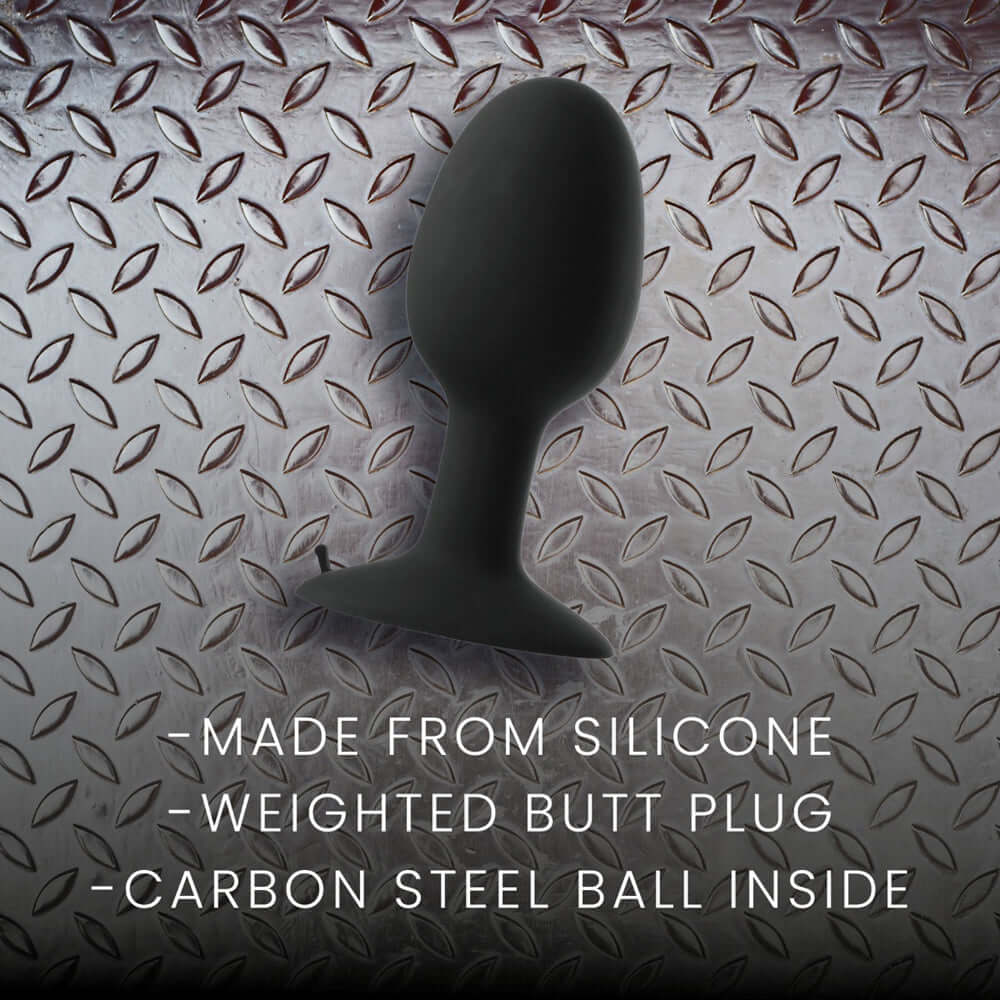 Prowler RED Weighted Butt Plug Black Large on textured metal background, featuring silicone material and carbon steel ball inside.