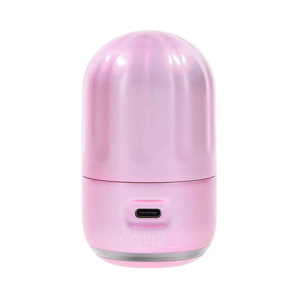 Evolved Vacation Vibes Vibrating Massager Pink Black in a stylish pink-pearl canister with textured lid.