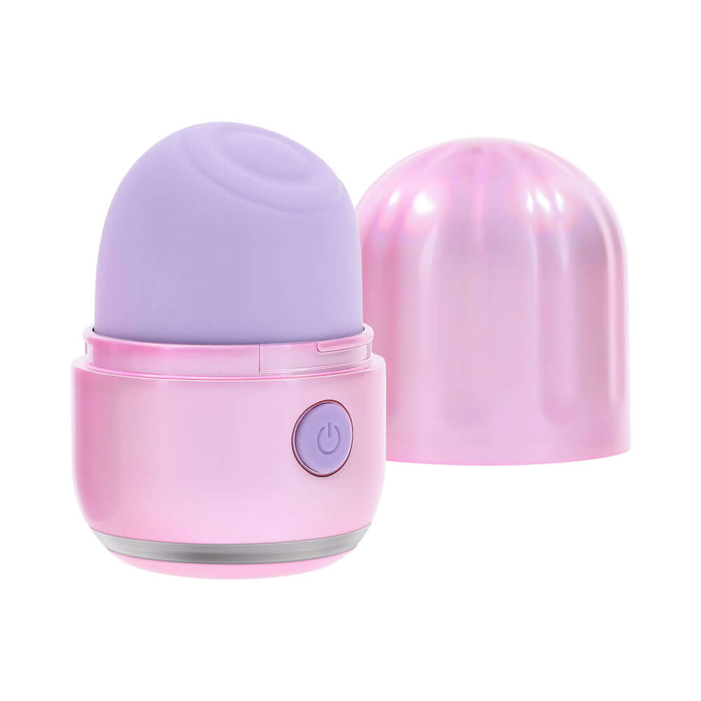 Evolved Vacation Vibes Tapping Massager in pink-pearl iridescent design with textured canister lid.