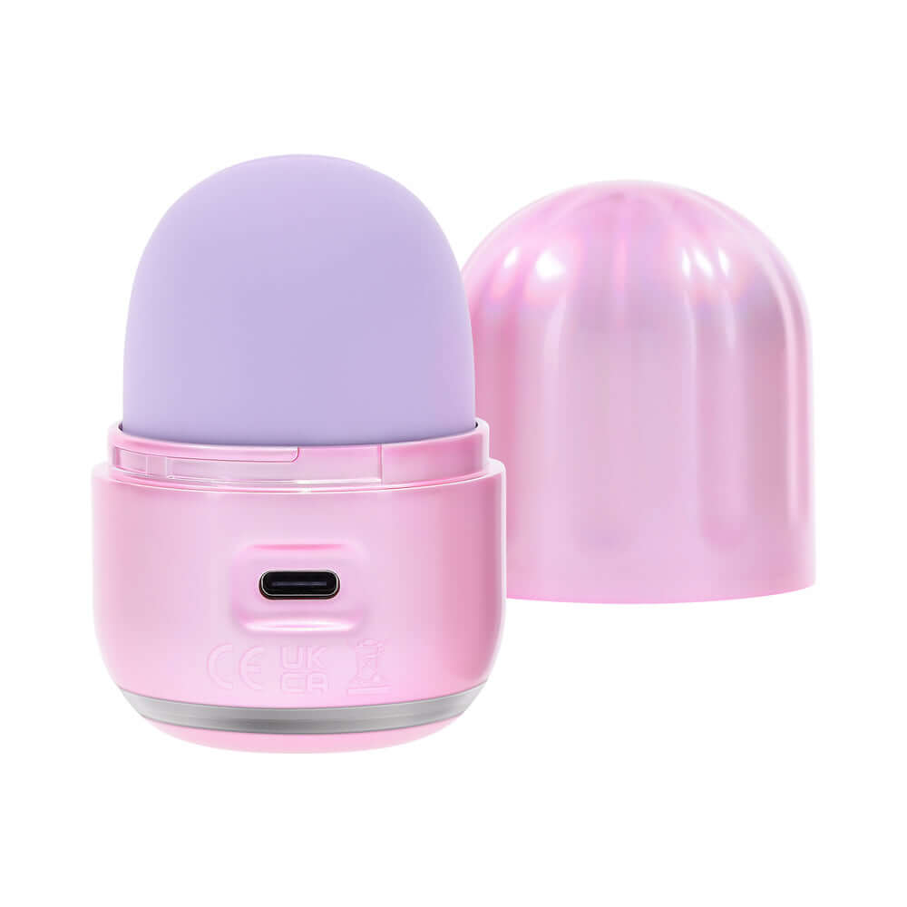 Evolved Vacation Vibes Tapping Massager in pink and lavender with a stylish textured canister lid.